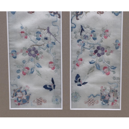 667 - A pair of Chinese silk embroidered panels depicting flowers and butterflies, framed & glazed as one,... 