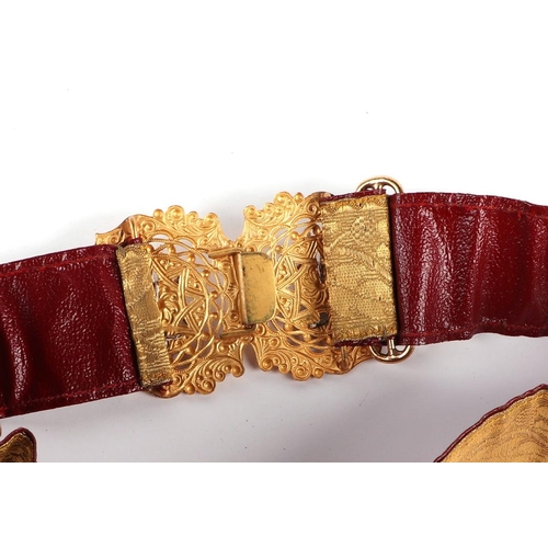 67 - An Army Educational Corp gilt metal buckle on a bullion wire and red leather belt.