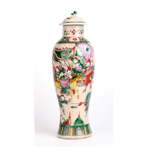 670 - A Chinese famille rose crackleware baluster vase and cover decorated with warriors, four character r... 