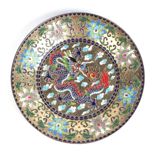 671 - A Chinese enamel and cloisonne dish decorated with a dragon amongst clouds with flowers, 24cms diame... 