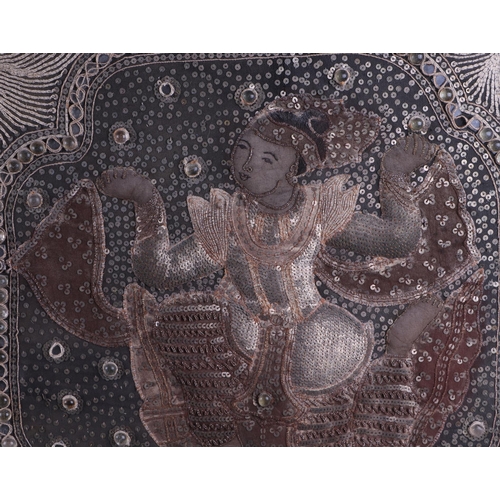 673 - A Thai textured bullion wire panel depicting two dancers, overall 108 by 68cms.