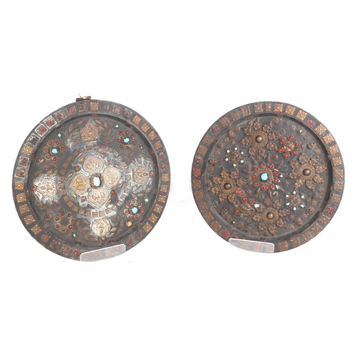 680 - Two Asian wooden roundels with applied brass decoration, approx 53cms diameter (2).