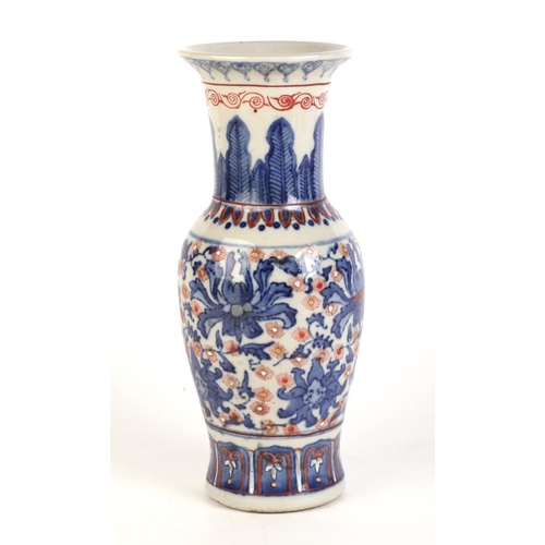 682 - A Chinese blue, red and white vase with six character red mark to the underside, 25cms high.