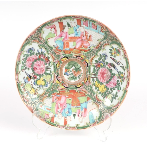 684 - A Chinese Canton Export famille rose shallow bowl decorated with figures and flowers within panels, ... 