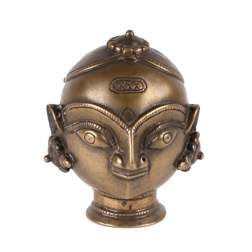 697 - A 19th century Indian bronze Gauri head, 11cms.