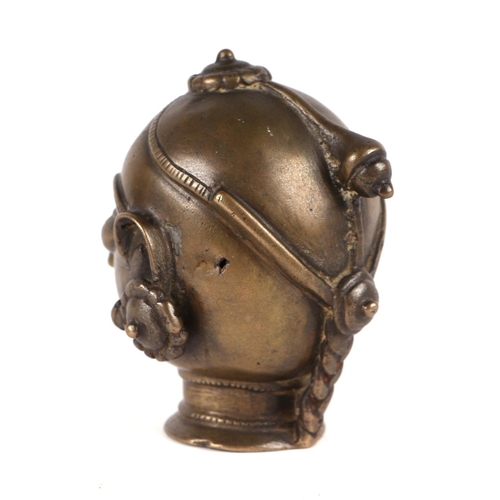 697 - A 19th century Indian bronze Gauri head, 11cms.