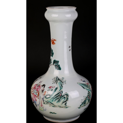 711 - A large Chinese famille rose bottle vase decorated with figures on a terrace, 43cms high.Condition R... 