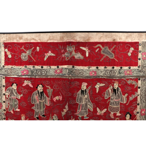 713 - A large Chinese silk embroidered panel decorated with figures in a landscape with bats and butterfli... 