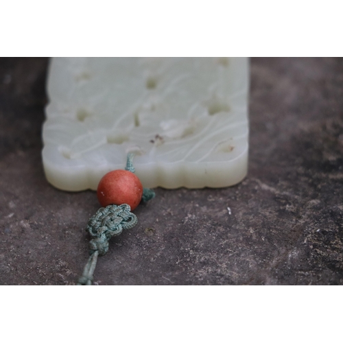 715 - A Chinese pierced jade pendant, 5 by 6.5cms.Condition ReportGood overall condition with no visible d... 