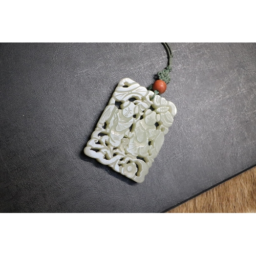 715 - A Chinese pierced jade pendant, 5 by 6.5cms.Condition ReportGood overall condition with no visible d... 