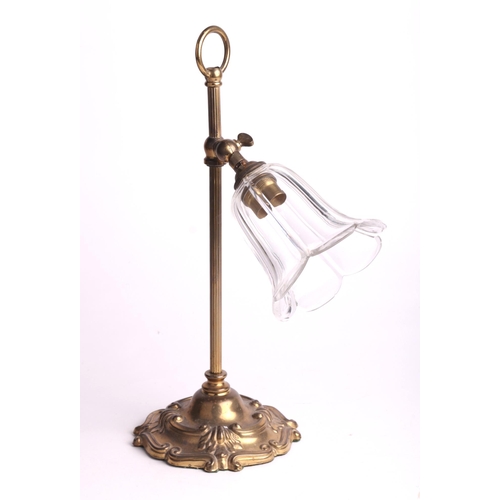 718 - A brass student type table lamp with cut glass shade, 34cms high.