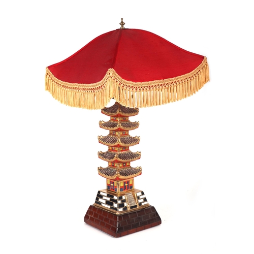 721 - A Japanese Satsuma table lamp in the form of a five-tier pagoda, overall 60cms high.