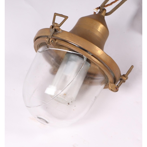 731 - A vintage brass industrial celling light with screw down glass shade, approx 35cm high.