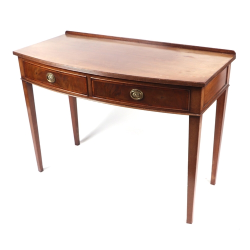 745 - An Edwardian mahogany bowfront side table with two frieze drawer on tapering legs, 108cm wide.