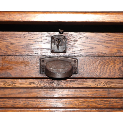 746 - An early 20th century oak tambour fronted filing cabinet, 55cm wide