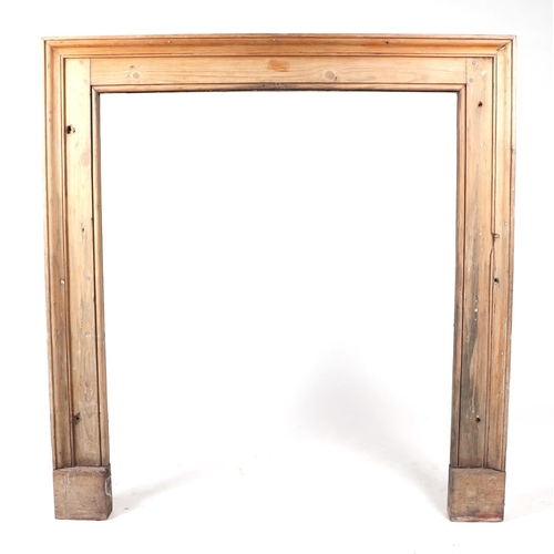 747 - A pine fire surround with mantle shelf, 106cm wide.