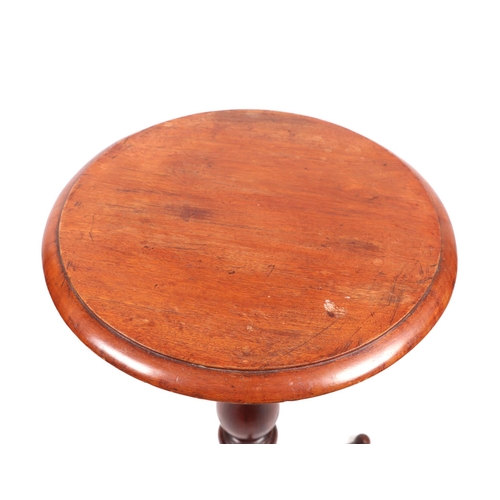 765 - A 19th century occasional table, the circular mahogany top on a turned pitch pine column and tripod ... 