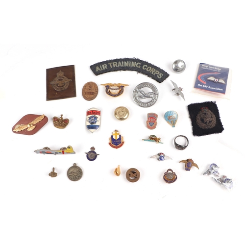 86 - A framed display of 20 Royal Air Force enamel badges together with an assortment of RAF and other av... 