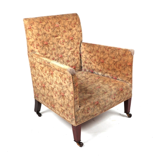 866 - An Edwardian upholstered armchair by Heal & Co.