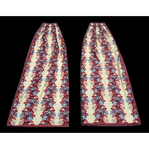 123A - A pair of lined curtains with floral decoration, 235cms drop and width 110cms (2).