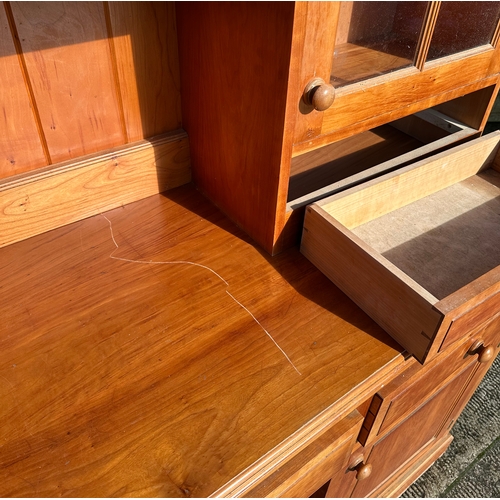 862 - A modern fruitwood style dresser with glazed superstructure above three frieze drawers with cupboard... 