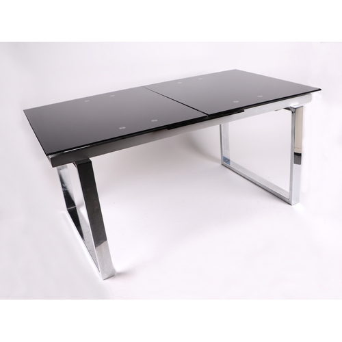 849 - A modern Italian design glass and chrome extending dining table  xxx size