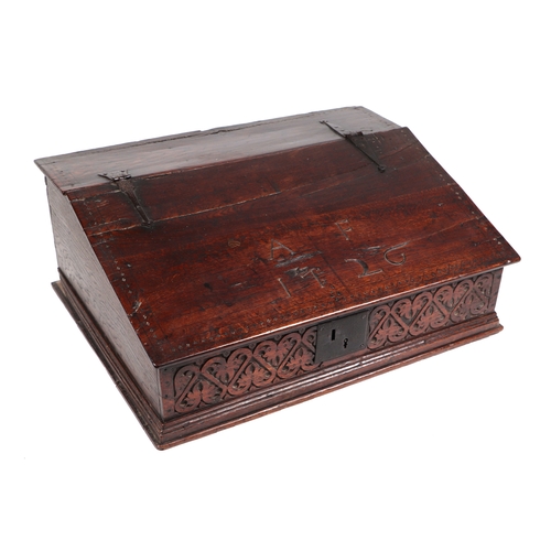 742 - An 18th century oak bible box, the sloped lid carved with the initials 'AF' and dated 1726, lifting ... 