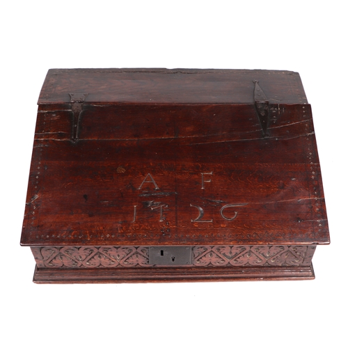 742 - An 18th century oak bible box, the sloped lid carved with the initials 'AF' and dated 1726, lifting ... 