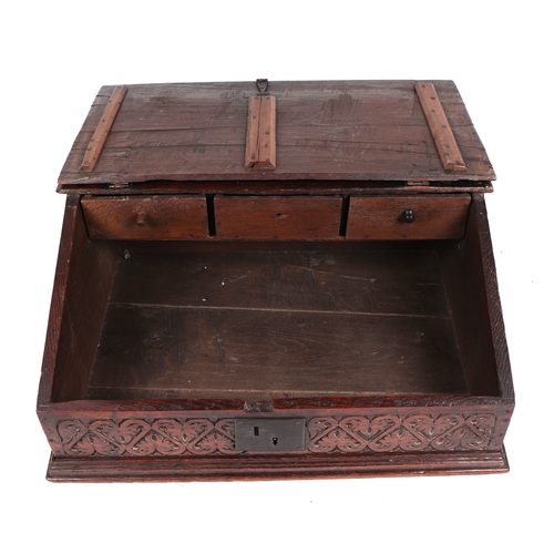 742 - An 18th century oak bible box, the sloped lid carved with the initials 'AF' and dated 1726, lifting ... 