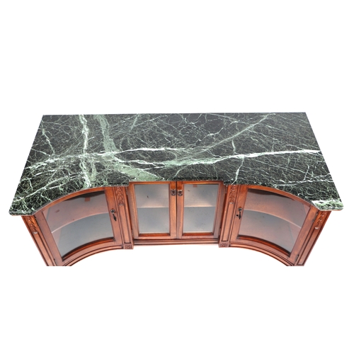 856 - A mahogany low side cabinet with shaped figured green marble top above glazed cupboards with interna... 