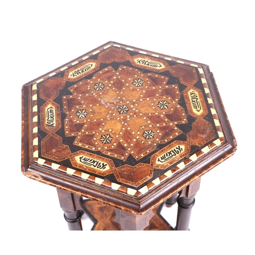 736 - An Islamic / Syrian hexagonal small occasional table with bone inlaid decoration, 42cms wide.