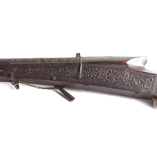 112 - An Indo-Persian Matchlock musket with ornate foliate scroll decoration, 153cms long.Condition Report... 