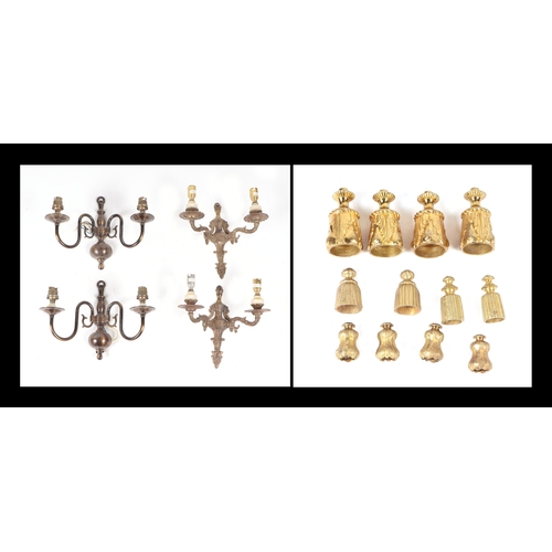 728 - A group of brass wall sconces and curtain tie-backs.