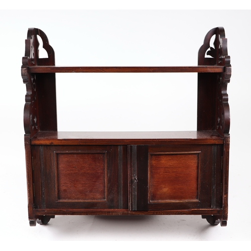 865 - A late 19th century set of walnut wall shelves, 60cms wide.