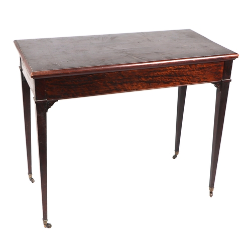 761 - An Edwardian mahogany fold-over top card table with counter wells, on square tapering legs terminati... 