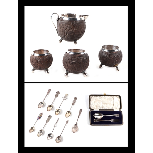 503 - Three white metal mounted coconut cups and matching jug; together with a boxed silver fork & spoon s... 