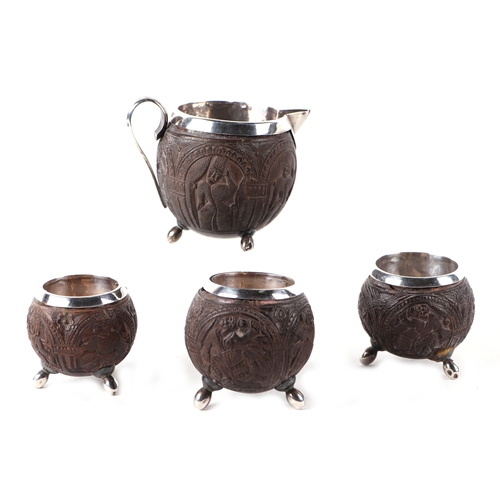 503 - Three white metal mounted coconut cups and matching jug; together with a boxed silver fork & spoon s... 