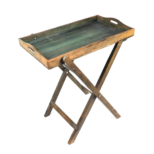 851 - A modern distressed stain butler's tray on stand, 61cms wide.