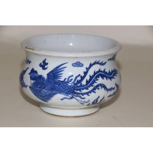 707 - A Chinese blue & white bowl decorated with dragons amongst clouds, 12cms diameter; together with a b... 