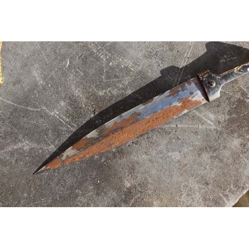 102 - A Middle Eastern dagger with horn handle, 42cms long.