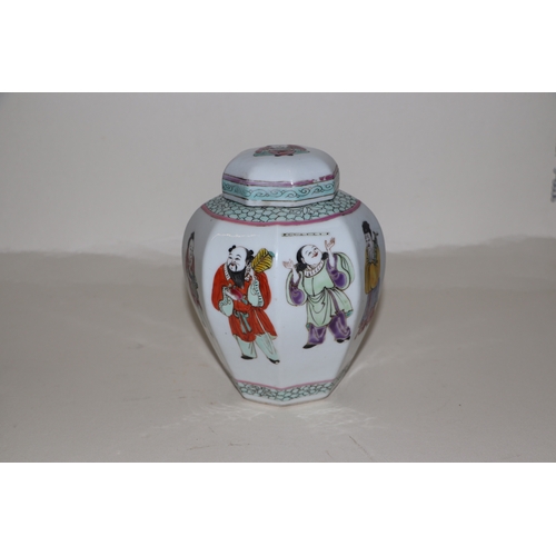 675 - A Chinese famille rose ginger jar and cover of octagonal form, decorated with figures, 15cms high.