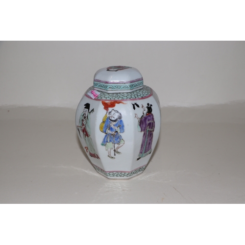 675 - A Chinese famille rose ginger jar and cover of octagonal form, decorated with figures, 15cms high.