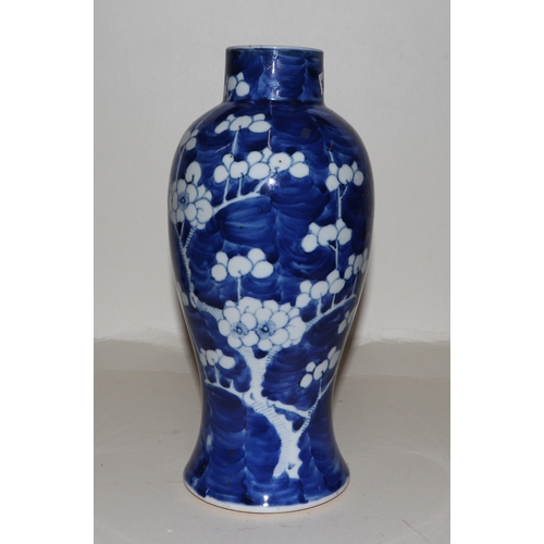 645 - A Chinese blue & white baluster vase decorated with prunus, 25cms high; together with two similar gi... 