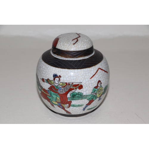 659 - A Chinese famille rose crackleware ginger jar and cover decorated with warriors, four character inci... 