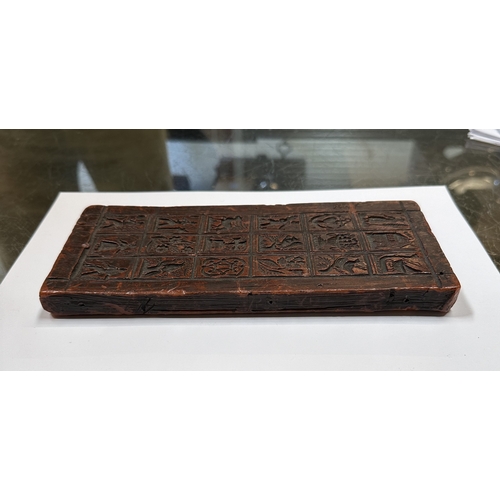 390 - A moulded wax printing block, 22 by 10cms.