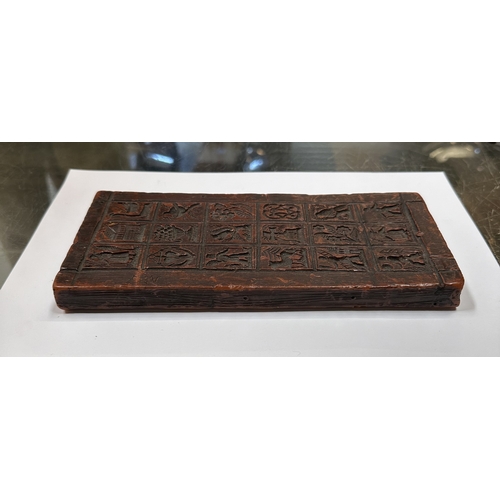 390 - A moulded wax printing block, 22 by 10cms.