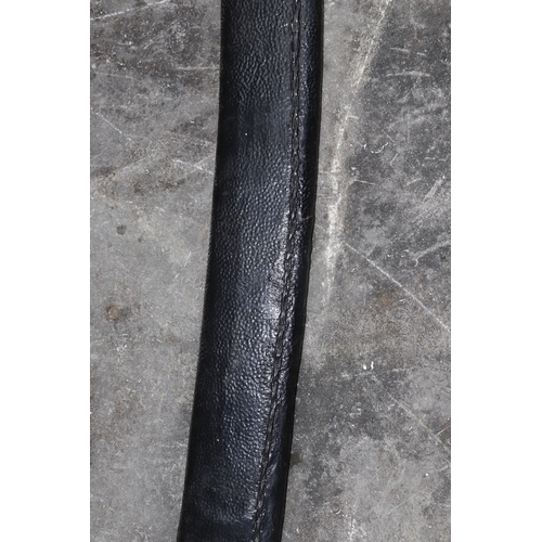 103 - An Asian sword in metal bound leather scabbard, overall 96cms long.