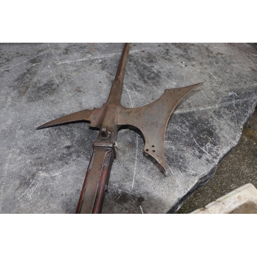 111 - A 16th century style continental Halberd on a chamfered oak shaft, 206cms high.