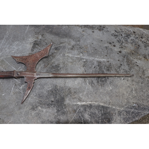 111 - A 16th century style continental Halberd on a chamfered oak shaft, 206cms high.