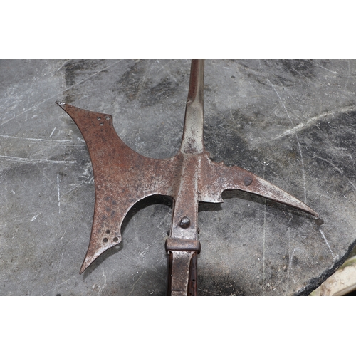 111 - A 16th century style continental Halberd on a chamfered oak shaft, 206cms high.